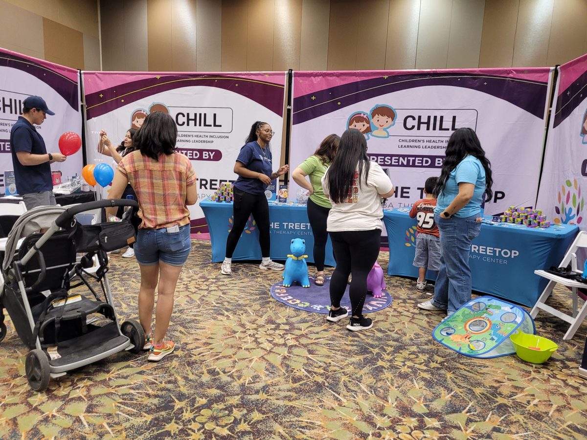 Phoenix families visiting the Treetop CHILL Act booth